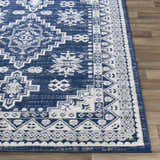 Close-up of the Ryton White&Blue Area Rug featuring a bohemian-inspired geometric pattern in shades of blue, gray, and white. Front