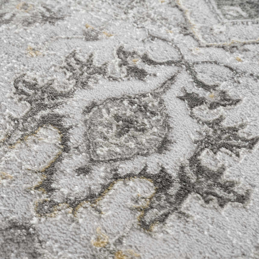 Close-up of the Liverpool Light Gray Area Rug showing its charcoal floral pattern and soft, textured polypropylene weave. Texture
