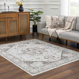 Living room scene with a light gray sofa and the Liverpool Light Gray Area Rug on a dark wood floor. Roomscene-Rectangle