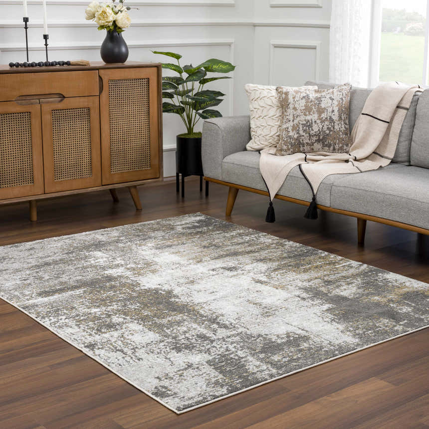 Living room scene with a gray sofa and the Liveree Abstract Area Rug in light gray, medium gray, off white, and rust. Roomscene-Rectangle