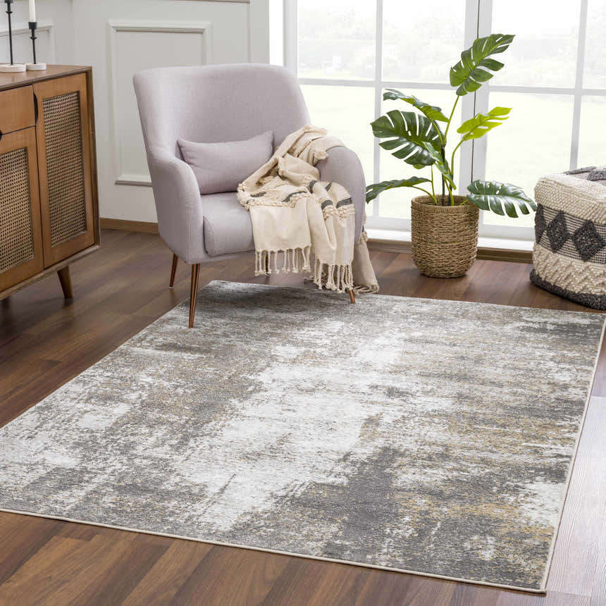 Living room scene with Liveree Abstract Area Rug, light gray chair, wood cabinet, and monstera plant. Roomscene-Rectangle