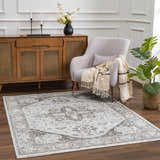 Living room scene with the Liverpool Light Gray Area Rug, light gray chair, and wood cabinet. Roomscene-Rectangle
