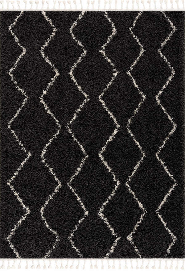 Close-up of the Ennis Area Rug. Charcoal shag rug with a light beige diamond pattern and tassels. Berber style. Design-Rectangle-23