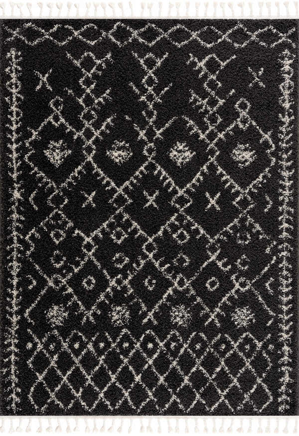 Close-up of Thetford Black Berber Shag Rug, featuring a charcoal base with light beige geometric patterns and fringe. Design-Rectangle-57