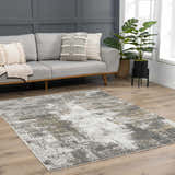 Living room scene with gray sofa and Liveree Abstract Area Rug in light gray, medium gray, off white, and rust. Roomscene-Rectangle