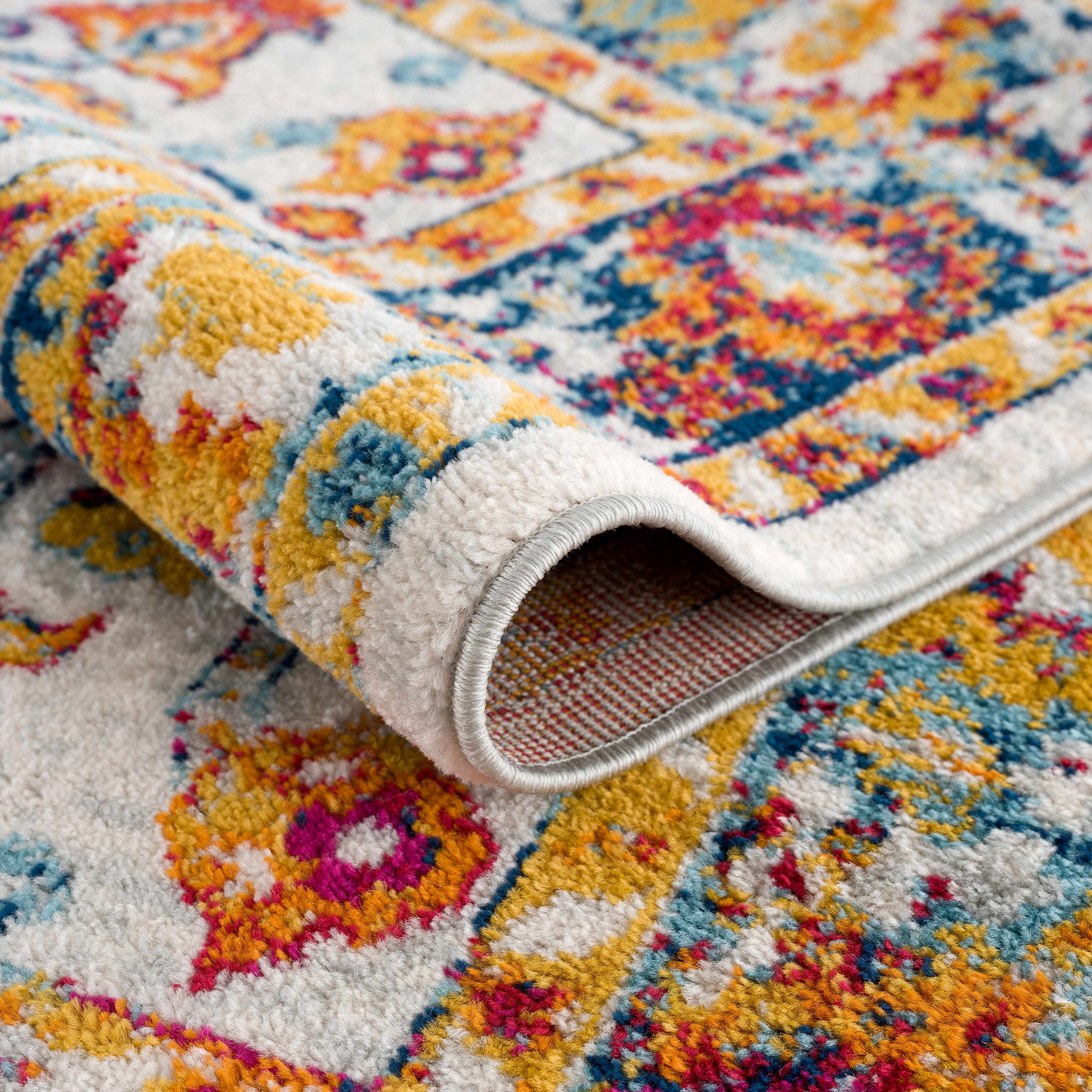 Folded section of Istanbul Colorful Rug - Clearance, displaying material thickness and weave.  Area Rug Backing Polyester 