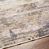 Close-up of the Asuna Area Rug showing its beige, brown and gray contemporary pattern and soft texture. Texture