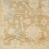 Close-up of the Tan Amiri Area Rug, a hand-knotted wool rug with a traditional floral pattern in tan, blue, and taupe hues. Swatch