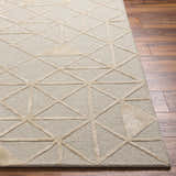 Close-up of the Botiu Blue Geometric Hand Tufted Wool Area Rug showing its light gray and pale blue geometric pattern. Front
