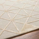 Close up of the Botiu Blue Geometric rug showing the hand tufted wool texture and geometric pattern. Texture