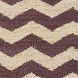 Close-up of Saginaw Jute Carpet. Beige and dark purple chevron pattern. Hand-woven texture. Farmhouse style rug. Swatch