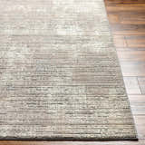 Close-up of the Chiyo Tan Plush Textured Washable Rug showing its tan color and subtle horizontal stripe pattern. Front