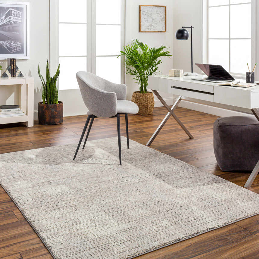 Bright home office with a Chiyo Tan Plush Textured Washable Rug, white desk, gray chair, and wood floors. Roomscene-Rectangle