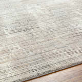 Close-up of the Chiyo Tan Plush Textured Washable Rug showing its plush pile and subtle horizontal stripe pattern. Texture