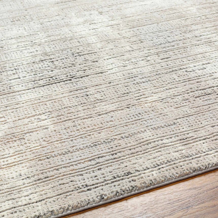 Close-up of the Chiyo Tan Plush Textured Washable Rug showing its plush pile and subtle horizontal stripe pattern. Texture