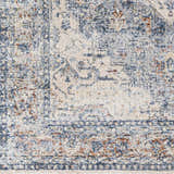 Close-up of the Salmo Area Rug. Cream rug with brick red, denim, and navy blue traditional pattern. Machine woven polyester. Swatch