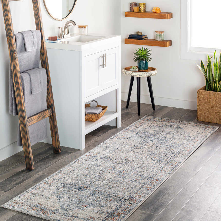 Bathroom scene with a brick red, cream, and navy Salmo Area Rug runner, white vanity, and wood accents. Roomscene-Runner