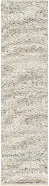 Close-up of the hand woven Salvo Luxury Wool Area Rug. Cream and black natural fiber rug with a subtle textured pattern. Design-Runner-2610