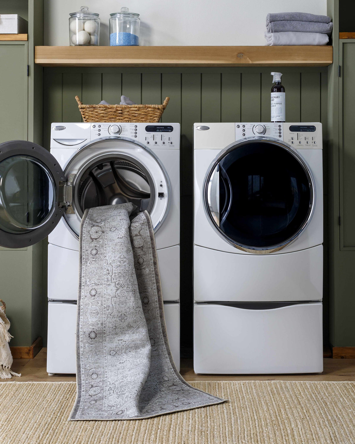 Laundry room scene with Anzu Washable Rug being washed in a front load washer. Farmhouse style laundry room. Washing-Machine