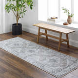 Entryway with wood floors, bench, and Athor Washable Rug in natural gray. Farmhouse style. Roomscene-Runner