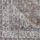 Close-up of the Athor Washable Rug. Traditional design in dark gray, eggplant, multi-brown, natural gray, and taupe hues. Swatch
