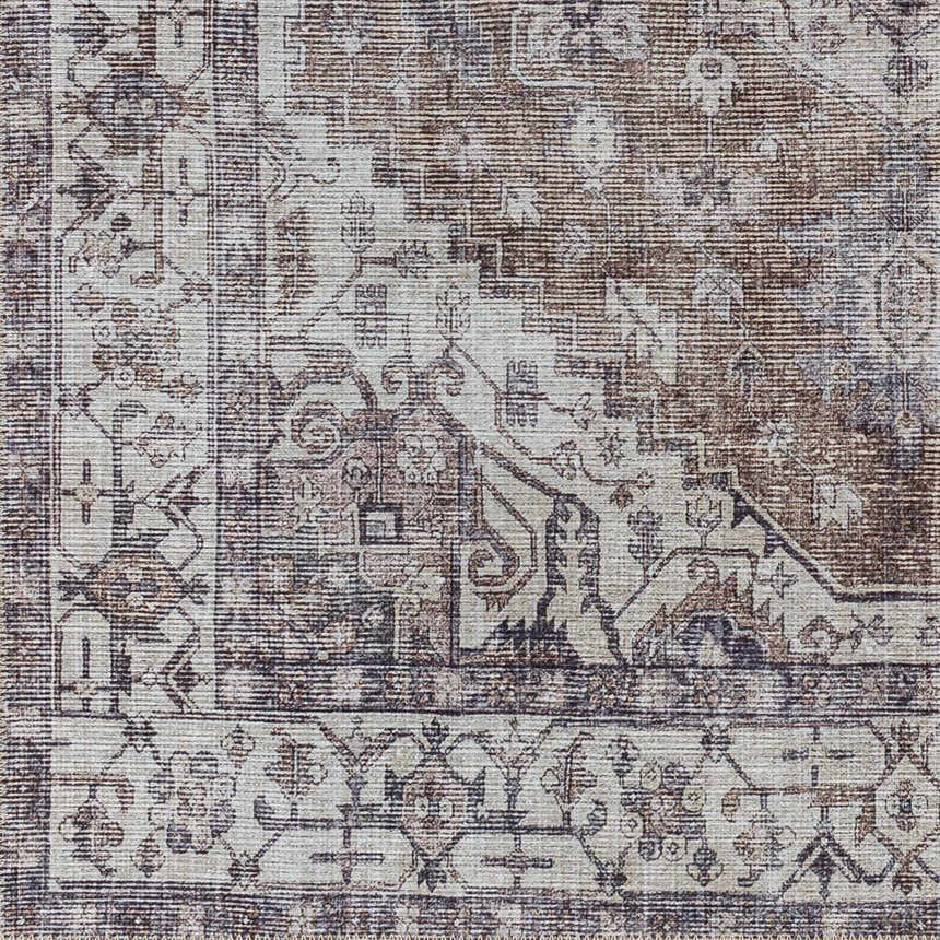 Close-up of the Athor Washable Rug. Traditional design in dark gray, eggplant, multi-brown, natural gray, and taupe hues. Swatch