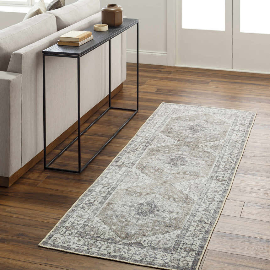 Living room scene with Athor Washable Rug runner in dark gray, eggplant, multi brown, and natural gray colors. Roomscene-Runner