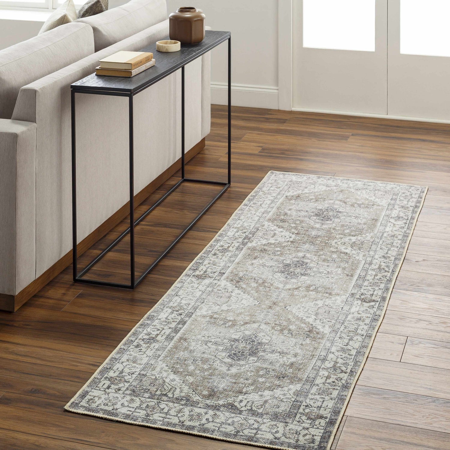 Living room scene with Athor Washable Rug runner in dark gray, eggplant, multi brown, and natural gray colors. Roomscene-Runner