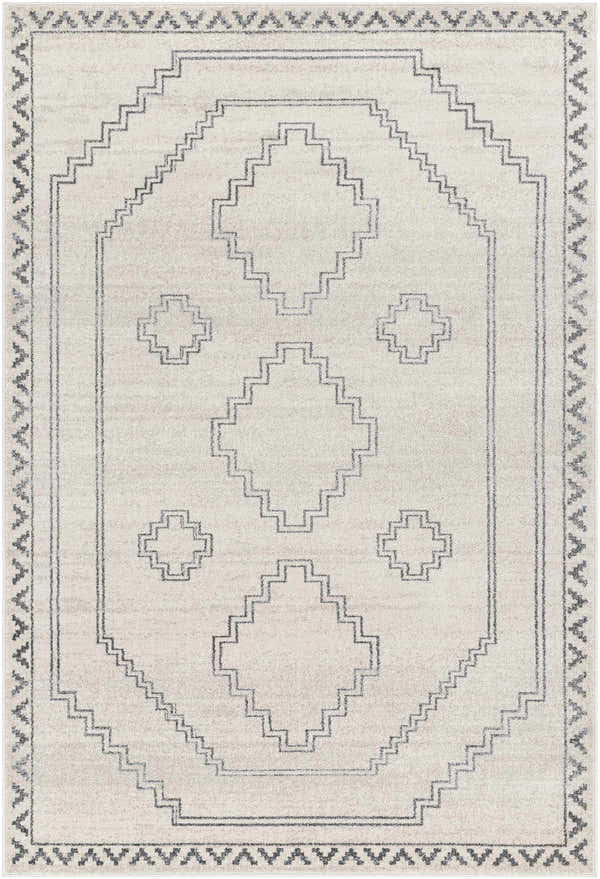 Close-up of the Naomh Area Rug. Rectangle rug in cream and charcoal with a geometric, farmhouse-style pattern. Design-Rectangle-537