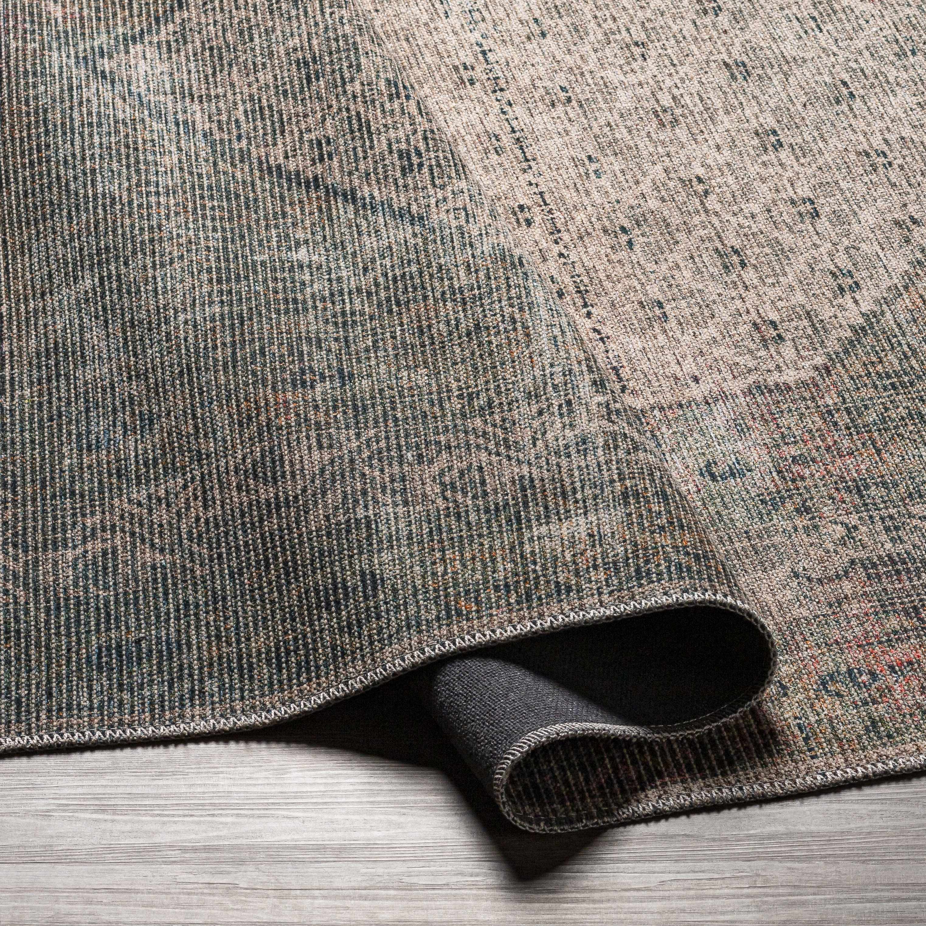 Folded section of Olive Sariaya Distressed Washable Area Rug - Clearance, displaying material thickness and weave. Traditional Area Rug Backing Canvas 