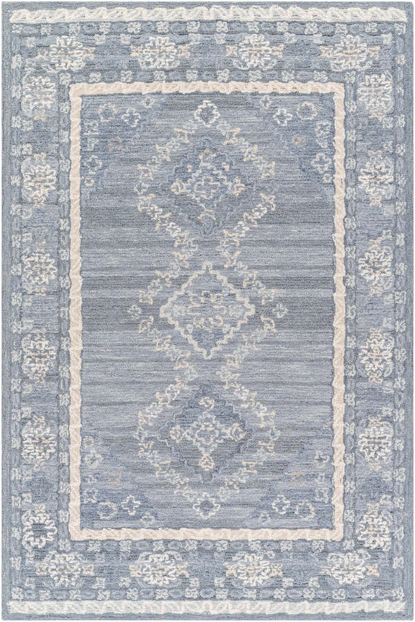 Close-up of the Alena Gray Blue Wool Blend Area Rug, featuring a traditional floral pattern and textured weave. Design-Rectangle-576