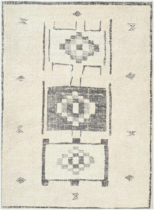Close-up of the Solana Medallion Charcoal rug by Livabliss x Becki Owens, featuring a beige base and charcoal geometric pattern. Design-Rectangle-537
