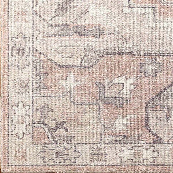 Close-up of the Elle Medallion Taupe Area Rug, showing its traditional pattern, beige, gray, and pastel red colors. Corner