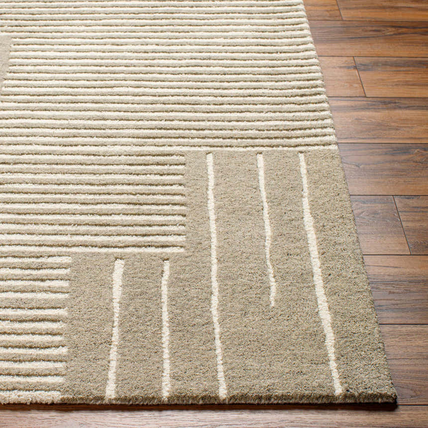 Close-up of the hand-tufted Akuji Area Rug. Contemporary design with linear pattern in light peach and medium gray wool. Front