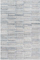 Close-up of the hand-tufted Darcy Area Rug. Features a geometric pattern in shades of blue, gray, and cream. Design-Rectangle-576