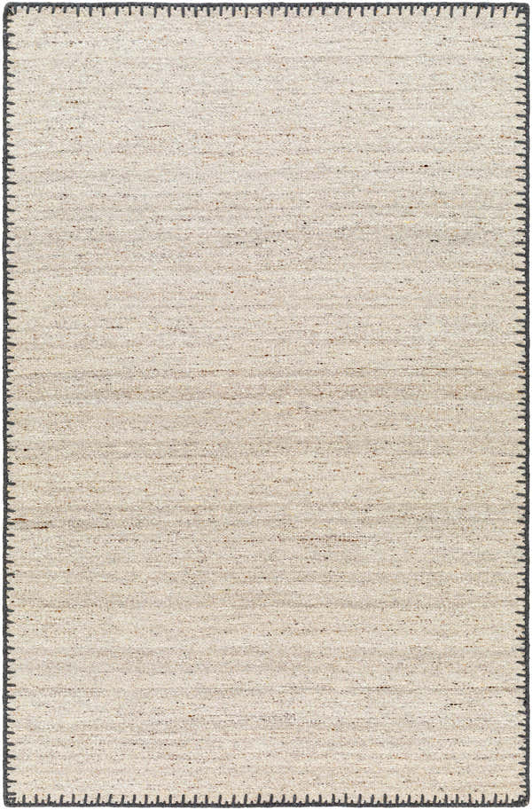 Close-up of the Ayumu Beige Hand Woven Wool Area Rug, showing texture and dark gray stitched border. Farmhouse style. Design-Rectangle-576