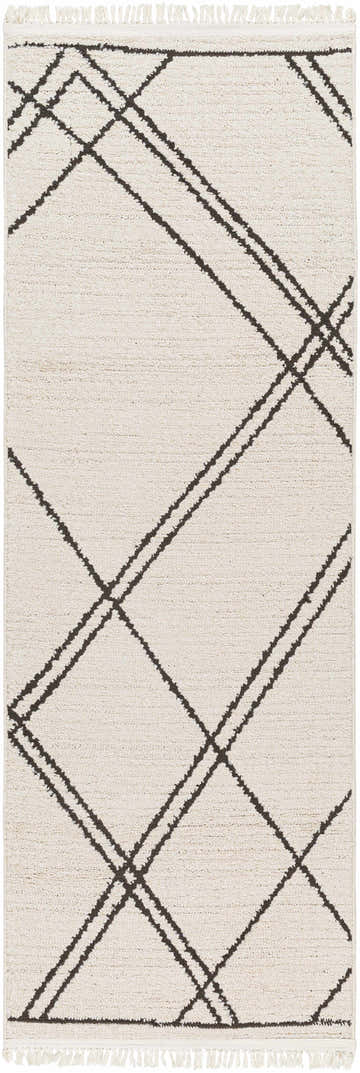 Close-up of Ausca Area Rug. Bone rug with dark brown geometric lines and fringe. Bohemian, farmhouse style. Design-Runner-2773