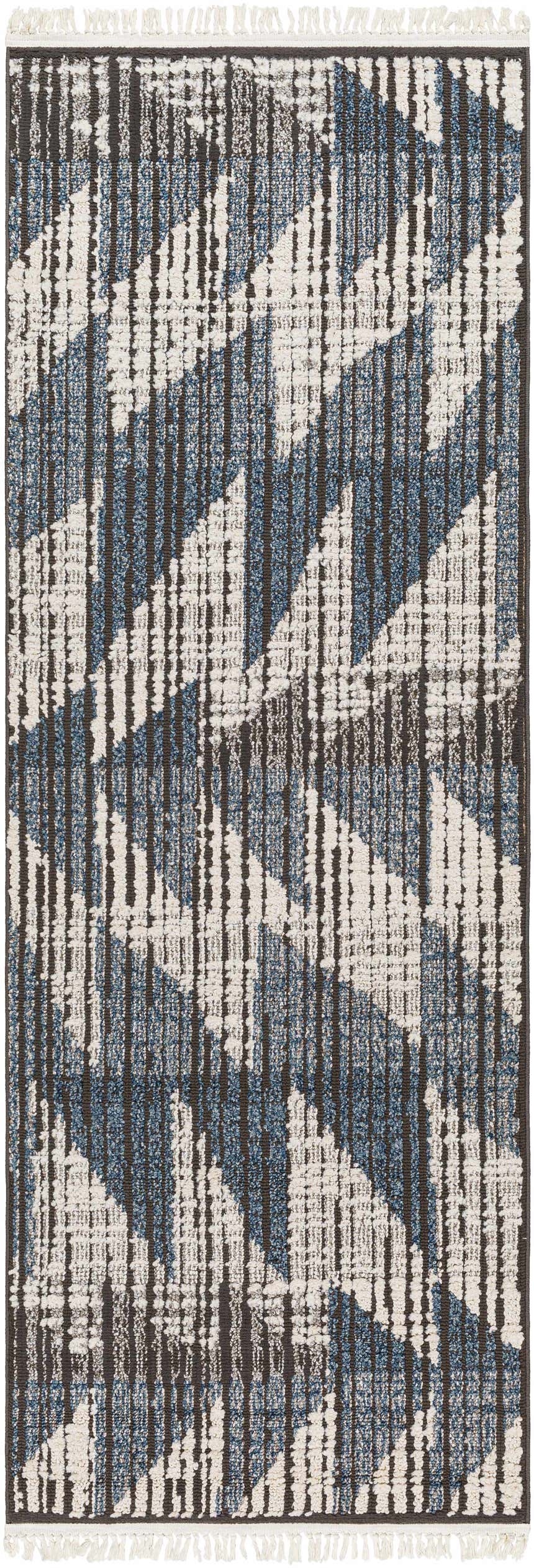 Close-up of the Zaim Area Rug. Bohemian geometric design in blue, white, and dark gray. Machine woven texture. Design-Runner-2773