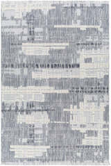 Close-up of Bodhi Textured Saxony Rug with Fringes. Abstract geometric pattern in charcoal, light gray, and white. Design-Rectangle-5373