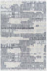 Close-up of Bodhi Textured Saxony Rug with Fringes. Abstract geometric pattern in charcoal, light gray, and white. Design-Rectangle-5373