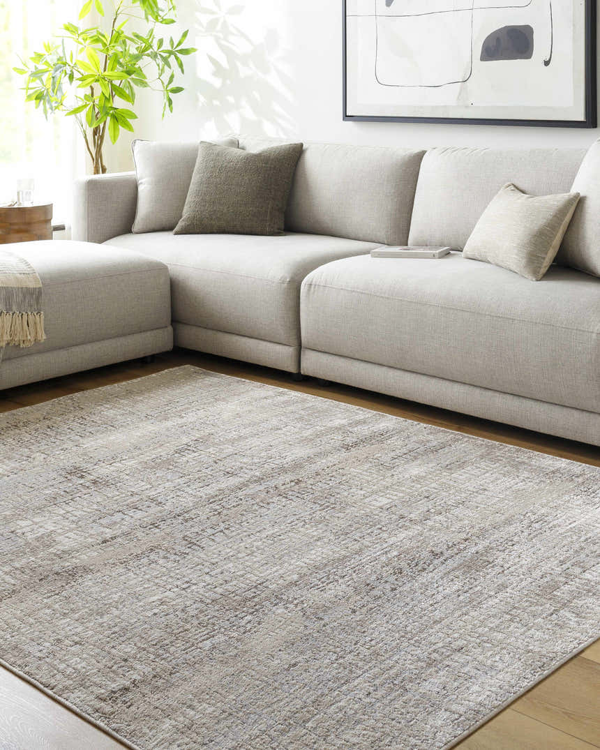 Living room scene with a gray sectional sofa and the Odeya Area Rug in cloud gray and medium gray. Roomscene-Rectangle