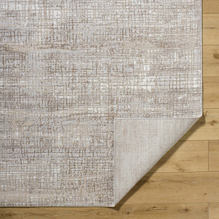 Close-up of the Odeya Area Rug showing its cloud gray and medium gray Southwestern-style pattern and machine-woven texture. Fold