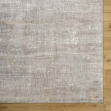 Close-up of the Odeya Area Rug. Cloud gray and medium gray Southwestern design with a subtle grid pattern. Corner