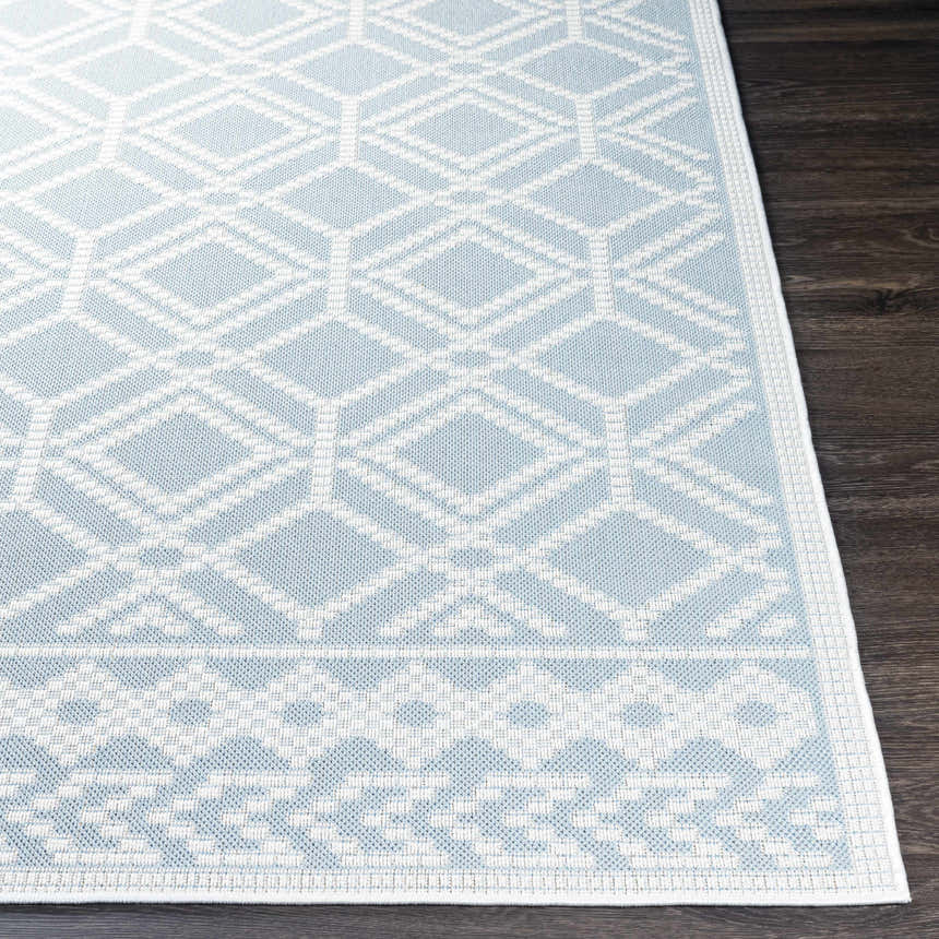 Close-up of the Scawby Area Rug: light blue and white geometric pattern, suitable for bathroom or kitchen. Front