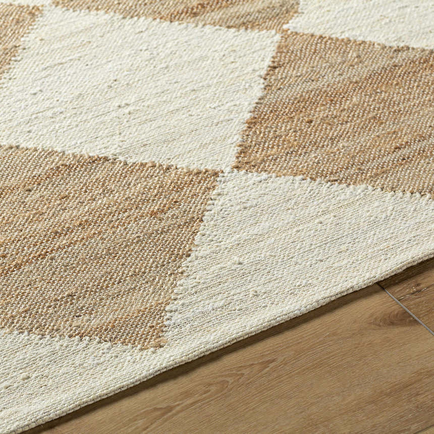 Close-up of the hand woven Sondo Beige Area Rug featuring a contemporary block pattern in beige and light wood tones. Texture