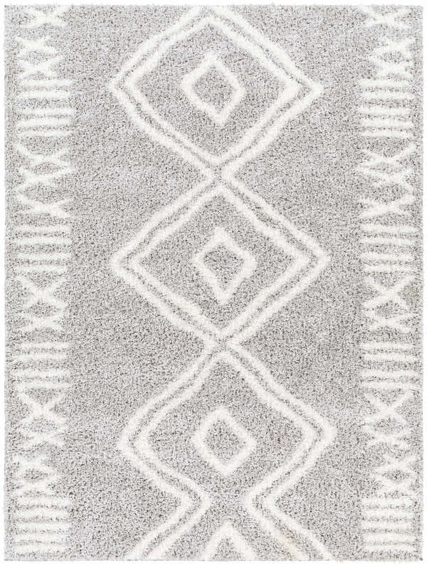 Close-up of the Asael Gray Area Rug, featuring a geometric diamond pattern and soft, shaggy texture. Design-Rectangle-537