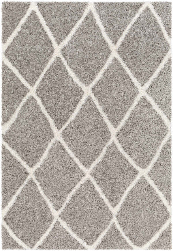 Close-up of the Faye Area Rug, featuring a charcoal shag texture and off-white geometric diamond pattern. Design-Rectangle-537