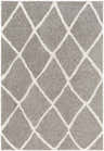 Close-up of the Faye Area Rug, featuring a charcoal shag texture and off-white geometric diamond pattern. Design-Rectangle-537
