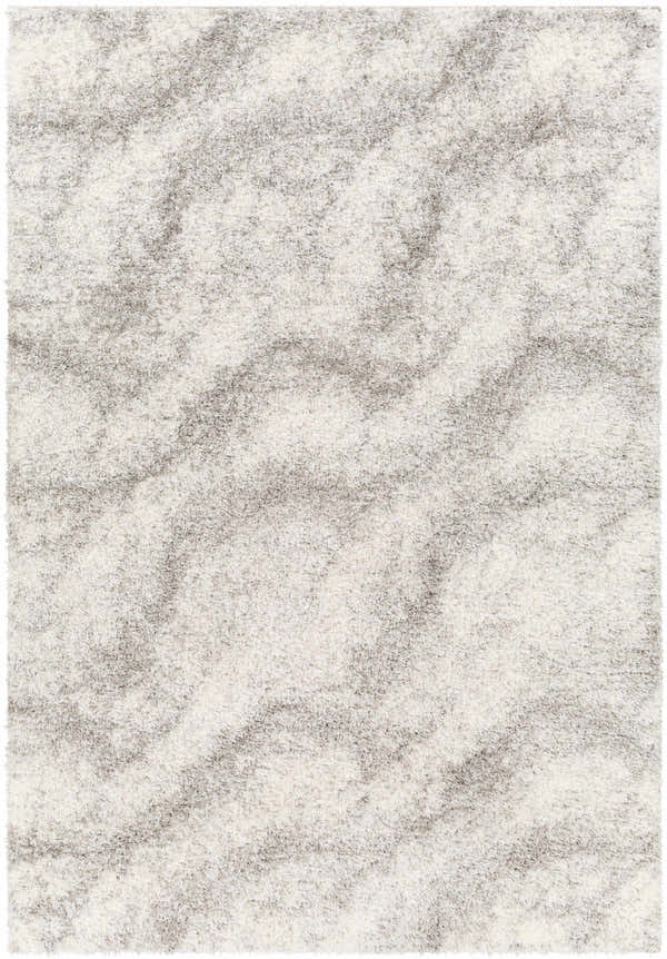 Close-up of the Giah Area Rug. Shag texture with bone, off white, and dark gray tones creating a subtle wave pattern. Design-Rectangle-537
