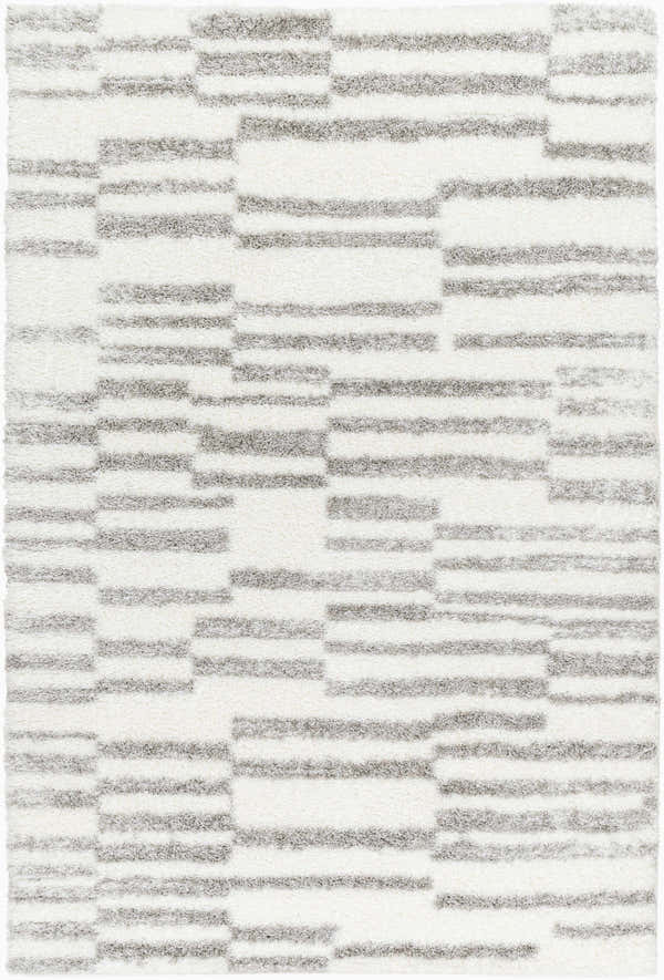 Close-up of a plush Kuron Area Rug with a contemporary gray and off-white geometric shag design. Design-Rectangle-537